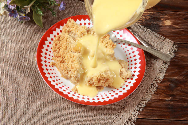 istock Freshly baked Apple Crumble Pie with Custard 1205527164