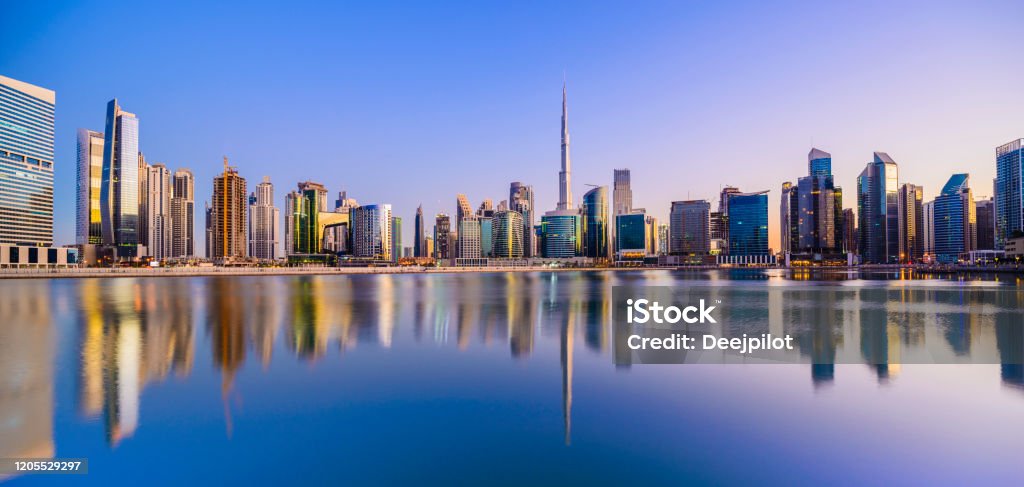 Panoramic View of the Downtown Dubai City Skyline and Business Park at Sunset, United Arab Emirates Reflections in the Still Waters, Copy Space Dubai Stock Photo