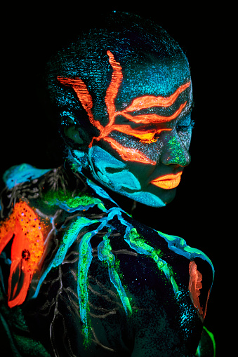 Close up UV portrait of a bodyart flamengo