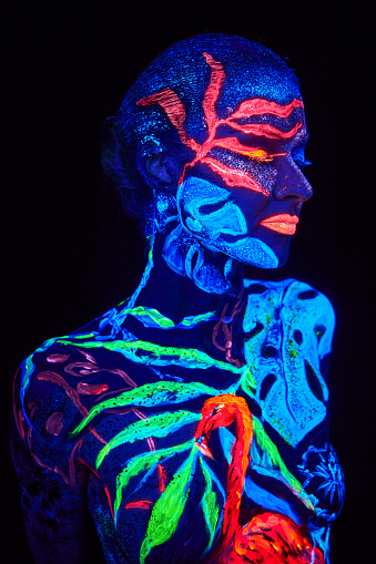 Close up UV portrait of a bodyart flamengo