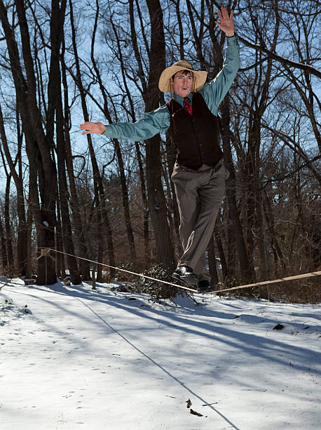 Man on Slackline in Formal Clothes stock photo