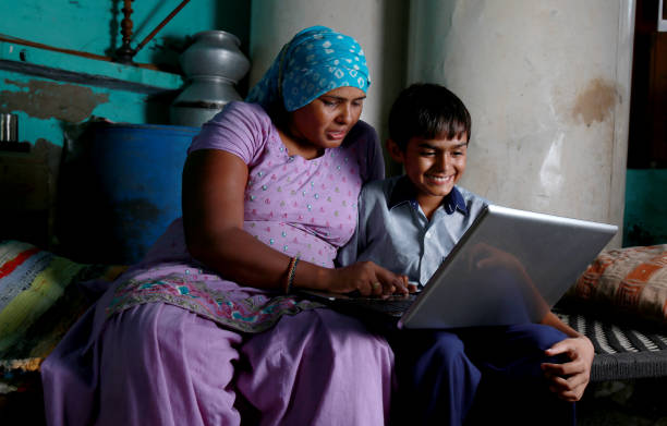 istock Mother and Son using Laptop at Home 1205533172