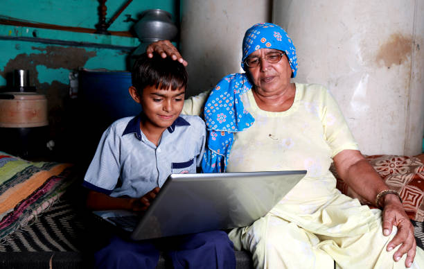 istock Indian family using laptop at home 1205533173