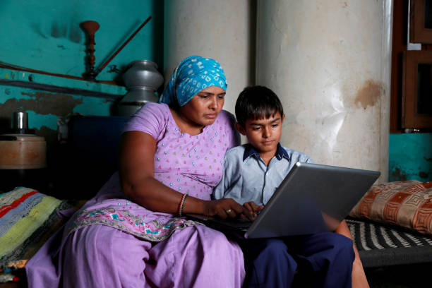 istock Mother and Son using Laptop at Home 1205533174