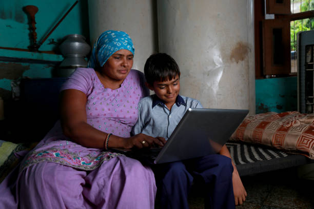 istock Mother and Son using Laptop at Home 1205533178