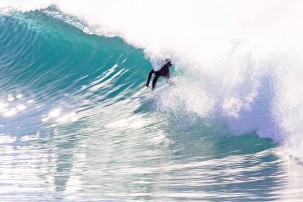 istock Man Surfing In Sea 1205534981