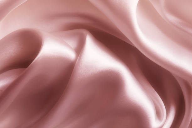 istock Satin pink silk background, close-up 1205536562
