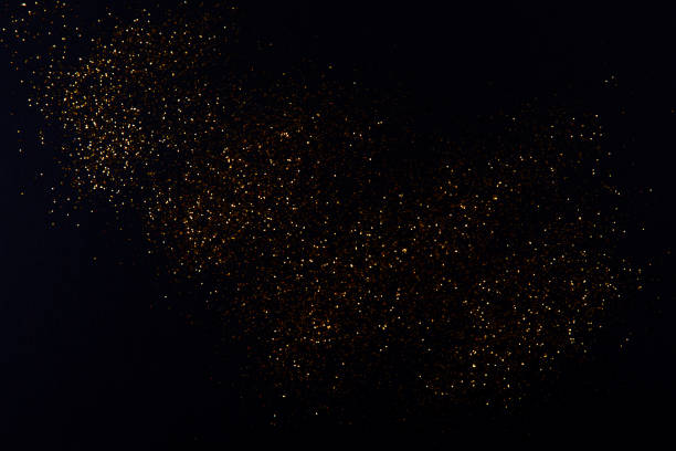 istock Beautiful blurred golden background on black 1205538278
