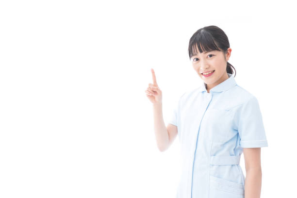 istock Young nurse pointing to something 1205539845