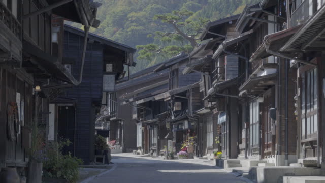 Unidentified people visit Narai Post town, Japan Old wooden house and narrow street in Kiso Valley of Nagano ,Japan.(Narai-Juku)