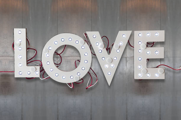 istock Electronic love on brushed metal texture 1205543151