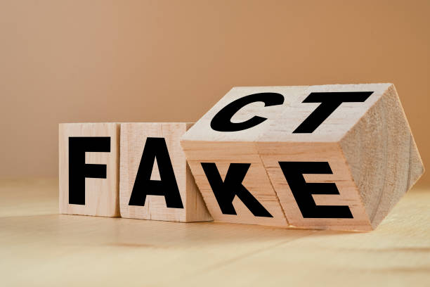 Flipping wooden cubes for change wording from "fact" to "fake". Flipping wooden cubes for change wording from "fact" to "fake". Fact from Fiction stock pictures, royalty-free photos & images