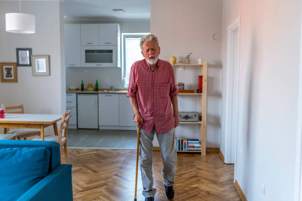 istock Senior Man Walking With Cane 1205545745