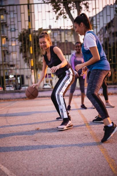 istock Girlfriends playing basketball 1205546286