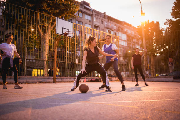istock Girlfriends playing basketball 1205546291