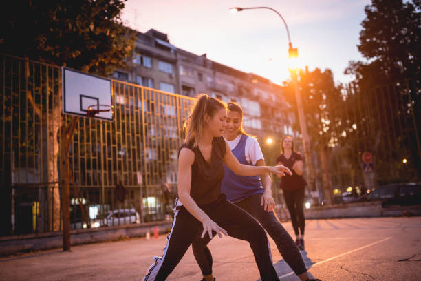 istock Girlfriends playing basketball 1205546293