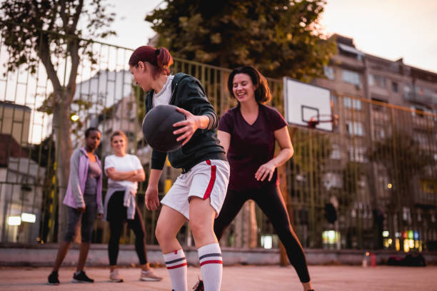 istock Girlfriends playing basketball 1205546300