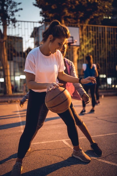 istock Girlfriends playing basketball 1205546311