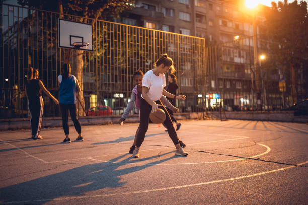 istock Girlfriends playing basketball 1205546325
