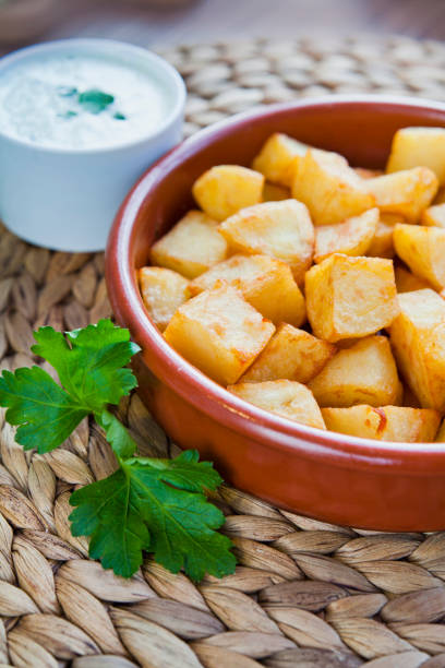 istock Spanish cuisine potato snack - potato bravas. 1205546731