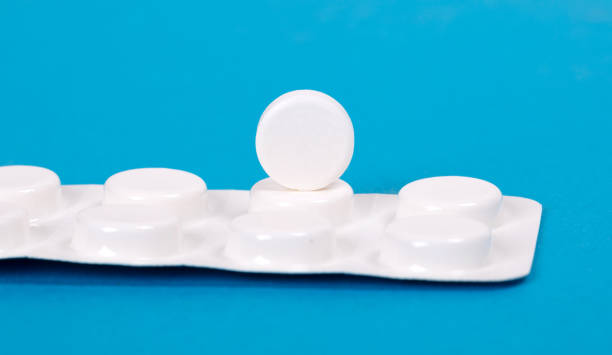 istock Pill isolated on blue background - Medicine concept 1205547753