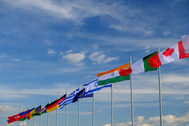 istock national flags of various countries flying in the wind. sky 1205548193