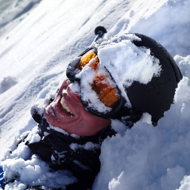 Male extreme skier riding backcountry in the deep snow on a sunny day in St. Anton, Austria