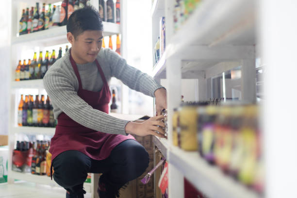 istock Asian man working in a deli store 1205549280