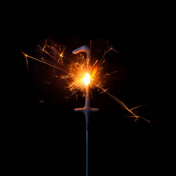 istock Burning sparkler in shape of number one, digit 1, isolated 1205549429
