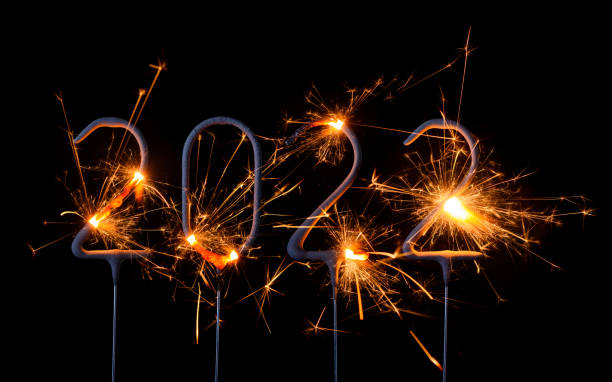 istock Happy New Year 2022 burning sparklers 1205549488
