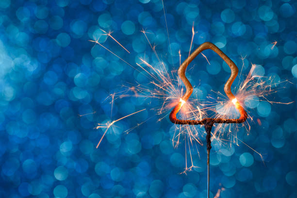 istock Burning sparkler in Christmas new year tree shape 1205549564