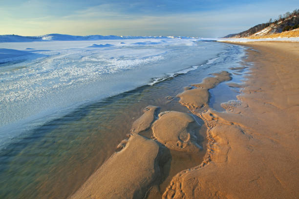 Iced shoreline of Lake Michigan near sunset, Saugatuck Dunes State Park, Michigan, USA