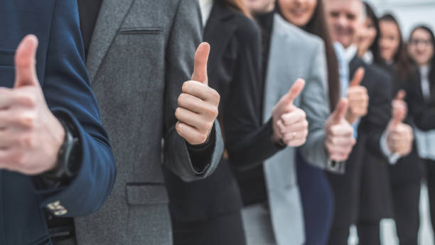 istock large group of young entrepreneurs showing thumbs up 1205549904
