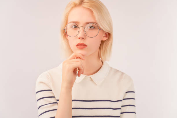istock girl has serious look at camera, has gentle smile 1205550721