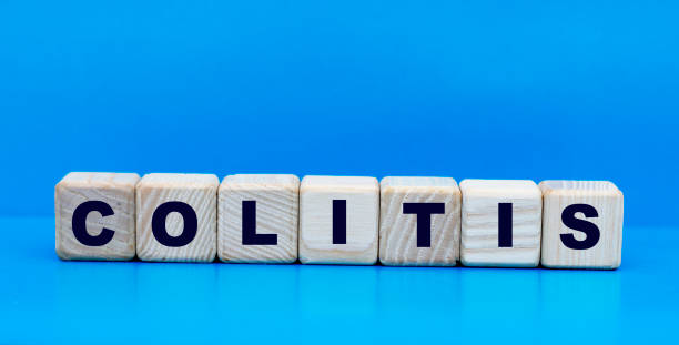istock concept word colitis on cubes on a blue background 1205550809