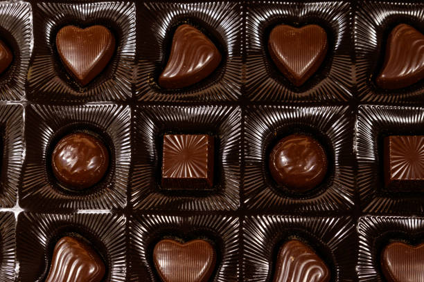 istock Assorted chocolate candies in a box. Close-up 1205551068
