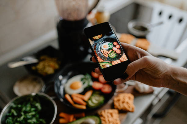 istock Photographing fried eggs with vegetables and fruits 1205551100