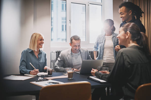 istock Diverse businesspeople laughing during an office meeting together 1205551264