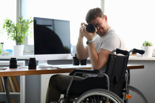 istock Male disabled photographer holds camera in his hands 1205552748