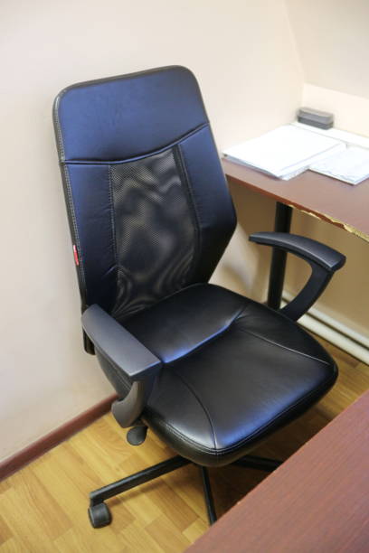 istock black office chair by the dark table 1205554010