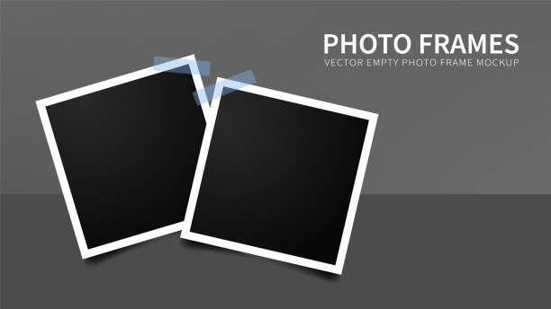 Set of empty photo frames. Set of empty photo frames with blue adhesive tapes. Vector realistic mockup. polaroid mockup stock illustrations