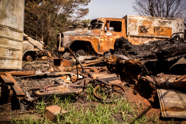 istock Building and car destroyed by fire during australian bushfires 1205556201