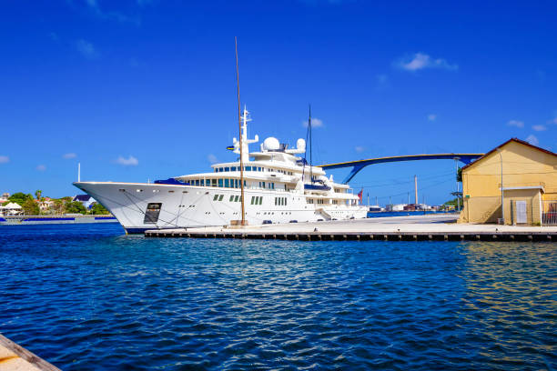 istock Massive luxury yacht docked near bridge on Curacao 1205556365