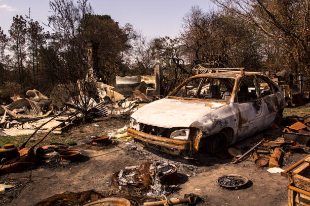 istock Building and car destroyed by fire. Bushfire aftermath, Australia 1205556384