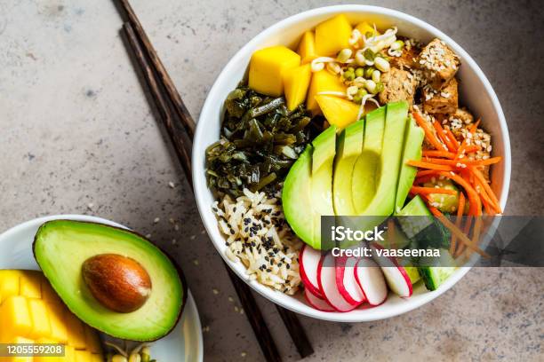 Vegan Poke Bowl With Avocado Tofu Rice Seaweed Carrots And Mango Top View Vegan Food Concept Stock Photo - Download Image Now
