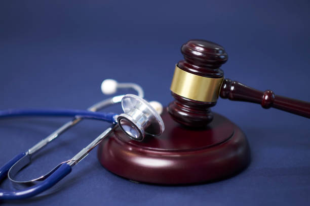 Stethoscope and judgement hammer. Gavel and stethoscope. medical jurisprudence. legal definition of medical malpractice. attorney. common errors doctors, nurses and hospitals make. stock photo