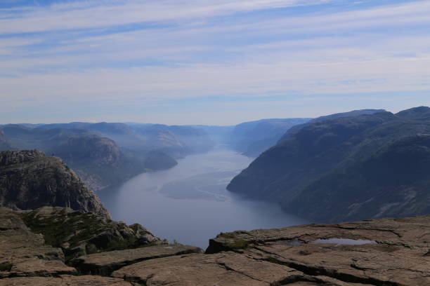 istock Preikestolen - famous cliff at the norwegian mountains 1205562563