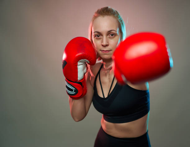 istock Female boxer with gloves on 1205564193