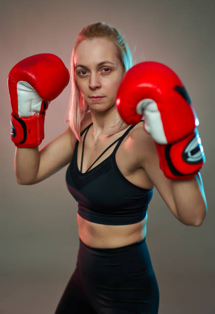 istock Female boxer with gloves on 1205564210