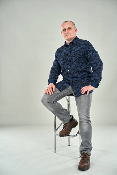 istock Businessman sitting on a tall chair 1205568622